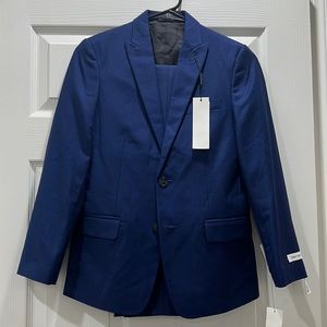slim fit Calvin Klein suit separates , blue jacket and pans . 12 regular